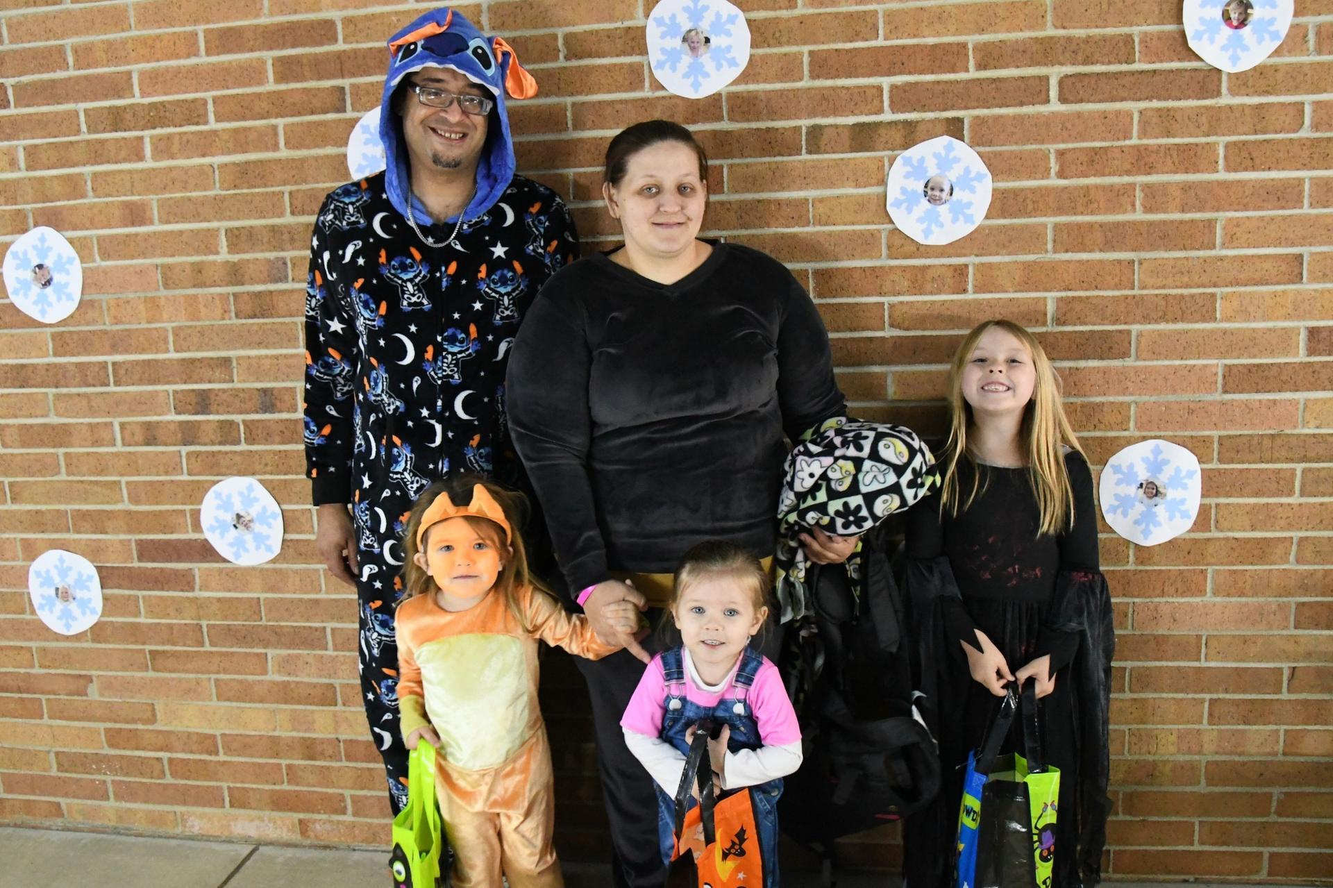 Picture of Franklin Trick-or-Treat event; family in costumes