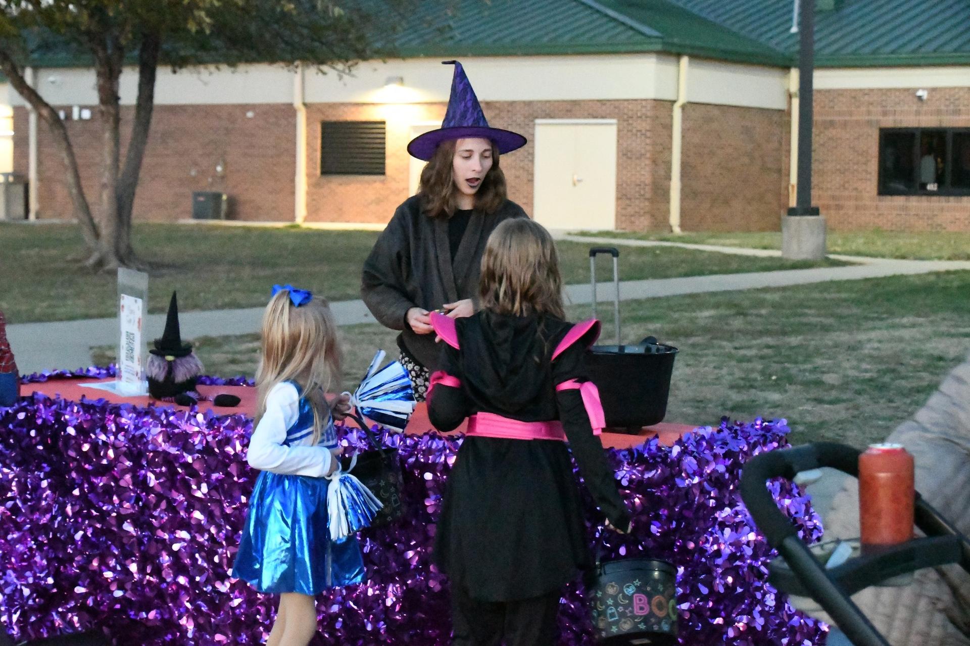 Picture of WES Trunk-or-Treat event; staff and students in costume